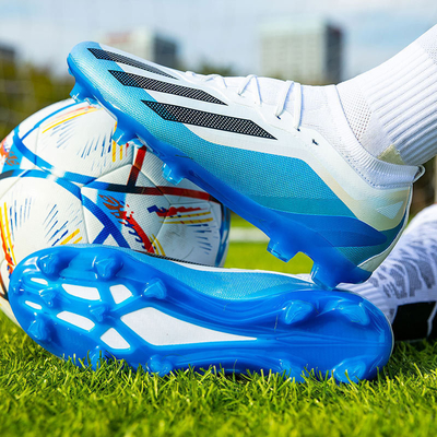 Chaussures de football bas de gamme pour les étudiants avec des épingles longues et courtes design unique chaussures d'entraînement de compétition de gazon artificiel