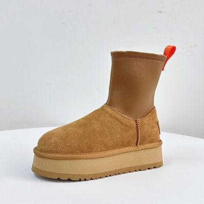 Bottes à crayon à semelle épaisse et mince pour femmes Nouvel hiver en plus de laine Bottes à neige épaissis pour femmes Vêtements extérieurs en cuir de vache imperméable