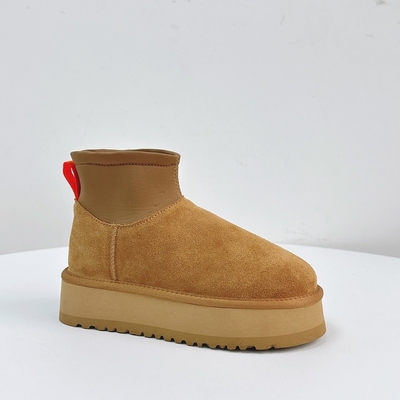 Bottes à crayon à semelle épaisse et mince pour femmes Nouvel hiver en plus de laine Bottes à neige épaissis pour femmes Vêtements extérieurs en cuir de vache imperméable